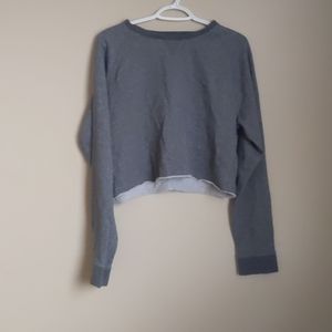 A grey cropped sweatshirt